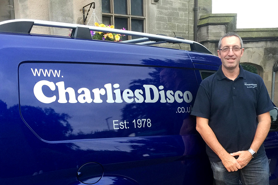 Charlie standing next to the van